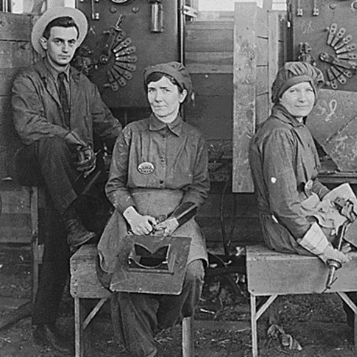 Black and white photograph of two women electrical welders seated on benches at the Hog Island Shipyard, 1918 ]